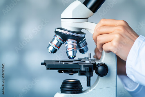 Close-up illustration of a researcher focusing on a microscope in a lab setting, showcasing precision in scientific research. Ideal for educational and medical use.