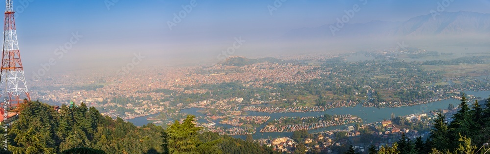 Panoramic aerial view of Srinagar city also known as city of lakes from Shankaracharya temple, Jammu and Kashmir. Srinagar is a popular honeymoon destination among tourist in India.