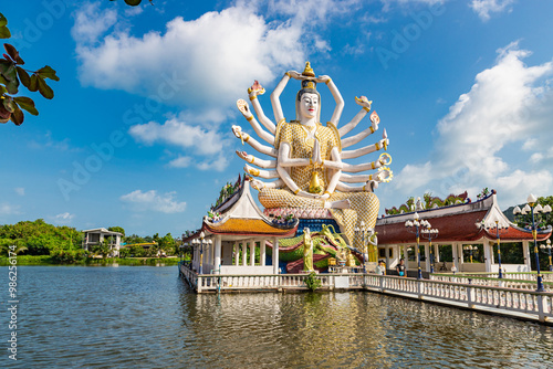 KOH SAMUI, THAILAND - JANUARY 30, 2024: The Guan Yin statue at Wat plai laem with tourists