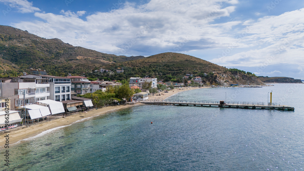 Fototapeta premium Cinarli Village view from sea in Marmara Island of Turkey. Aerial view of Marmara island Cinarli , Turkey. Marmara island view from sea in Turkey.