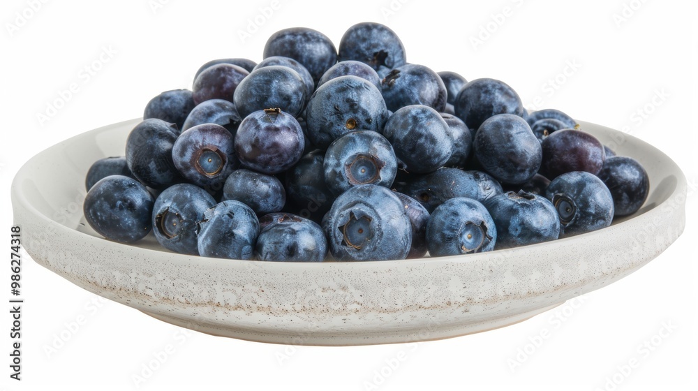 Blueberry fruit in plate isolated over white background Blueberry fruit in plate isolated over white background
