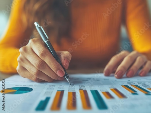 Businesswoman analyzing project budget variances and performance metrics, budget analysis, project performance photo