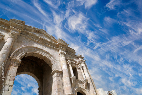 Arch of Hadrian in Gerasa (Jerash)-- was built to honor the visit of emperor Hadrian to Jerash in 129/130 AD, Jordan. Against the background of a beautiful sky with clouds #986303986