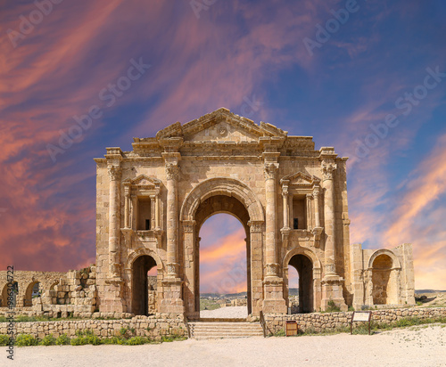 Arch of Hadrian in Gerasa (Jerash)-- was built to honor the visit of emperor Hadrian to Jerash in 129/130 AD, Jordan. Against the background of a beautiful sky with clouds #986304722