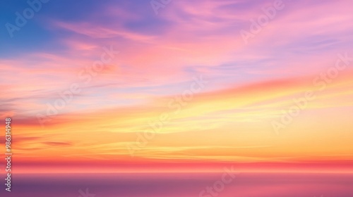 Fototapeta Naklejka Na Ścianę i Meble -  Colorful sunset sky with gentle orange and pink light reflecting off thin clouds