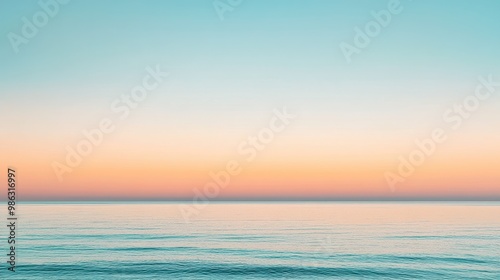 Clear sky at sunrise with soft pastel hues blending from blue to peach