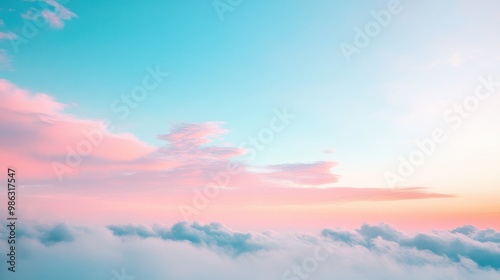 Clear sky with soft hues of blue and pink at sunrise