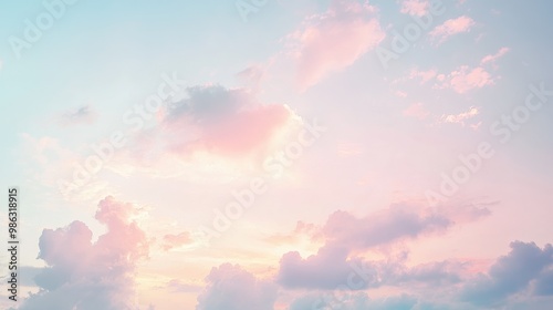 Serene morning sky with pastel tones of pink and blue as the sun rises