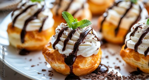 Tasty dessert with whipped cream and chocolate drizzle served at a casual gat...