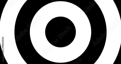 Moving hypnotic circle. Seamless Psychedelic round in fast motion. Black and white background.