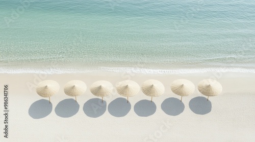 Tranquil Beach Scene with Colorful Umbrellas and a Comfortable Beach Chair, Inviting Relaxation Under Clear Skies and Gentle Waves photo