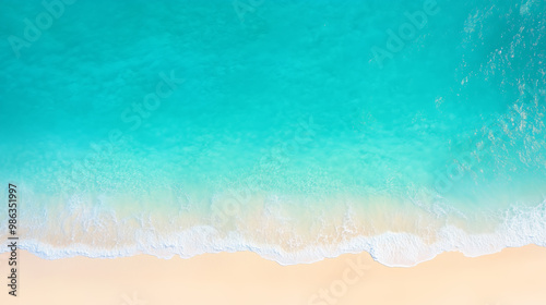 Aerial view of turquoise ocean meeting golden sandy beach