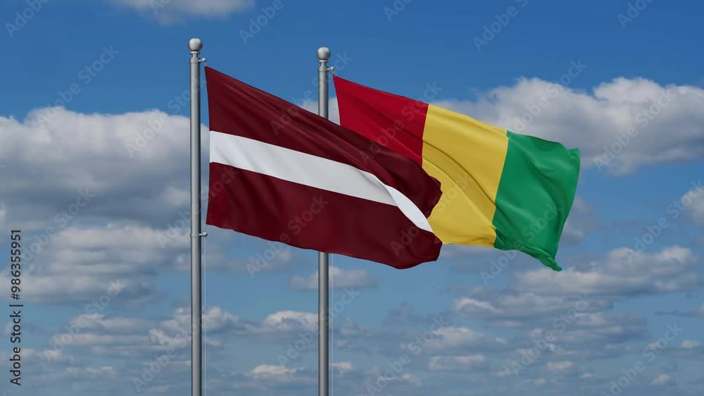 Republic of Guinea or Guinea-Conakry and Latvia flags flying together, video concept of the relationship, two country relations concept Republic of Guinea or Guinea-Conakry and Latvia flags flying together, video concept of the relationship, two country relations concept
