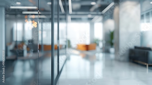 A bright, modern office interior featuring glass partitions, blurred background, soft lighting, and sleek contemporary furniture for a professional atmosphere.