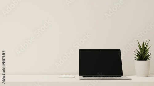 Minimalist home office setup featuring a laptop with a blank screen, a notebook, and a potted plant on a white desk against a plain wall