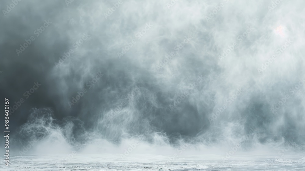 Fototapeta premium A gray, hazy sky with smoke and steam rising from the ground
