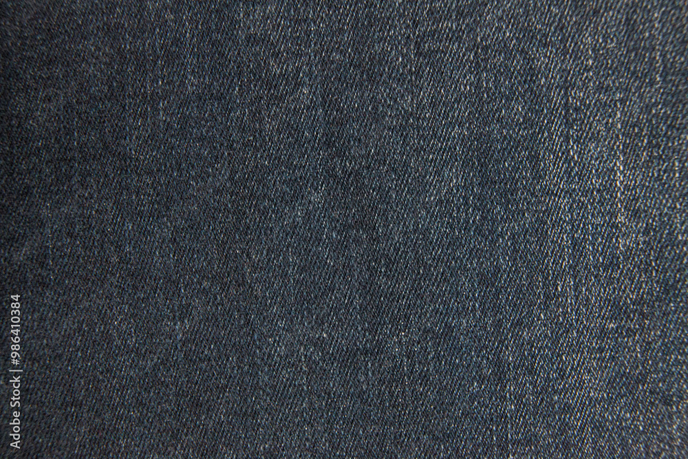 Macro closeup: dark blue denim fabric with intricate weave pattern and subtle variations in texture. Diagonal lines and tiny fibers create a rich tactile surface.
Macro closeup: dark blue denim fabric with intricate weave pattern and subtle variations in texture. Diagonal lines and tiny fibers create a rich tactile surface.