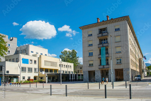 Kidriceva Ulica at the crossroads with Trg Edvarda Kardelja in downtown Nova Gorica. On the right is Nova Gorica Town Hall with a banner celebrating hosting the 2025 European Capital of Culture #986444153