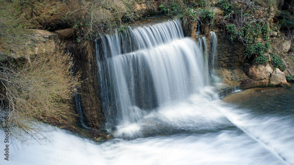 Obraz premium Water falls with long exposure in the Cerrada del Río Castril in the town of the same name, in Granada, Andalusia, Spain