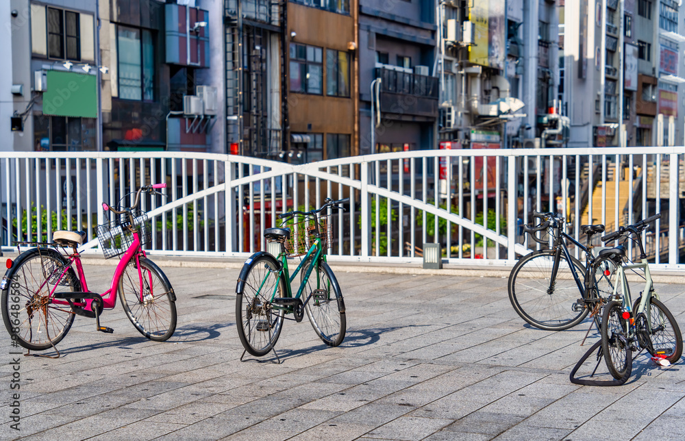 Bicycles parked on the sidewalk in Osaka, japan Bicycles parked on the sidewalk in Osaka, japan