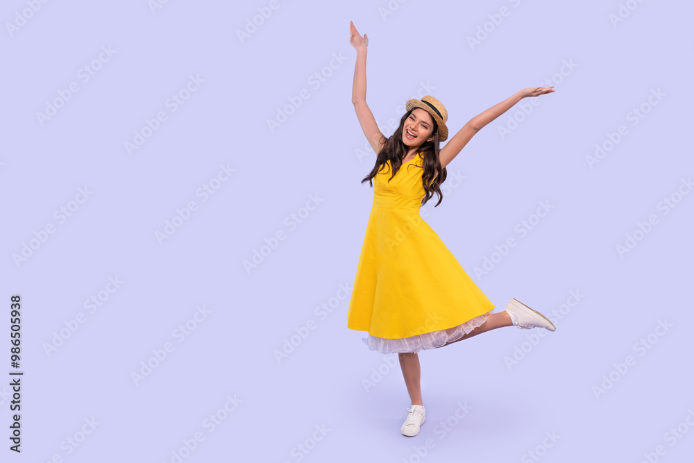 Joyful Girl in Yellow Dress Celebrating With Playful Pose Against Soft Lavender Background Joyful Girl in Yellow Dress Celebrating With Playful Pose Against Soft Lavender Background
