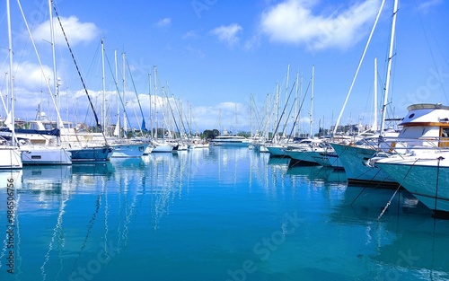 Beautiful yachts on the waterfront in the harbor. Sunny day and blue sea.