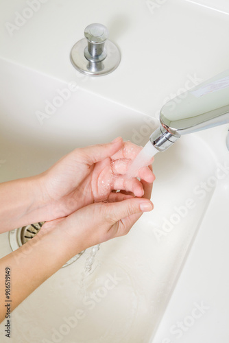 step by step hand washing, washing with running water from the tap lathered with soap or liquid soap