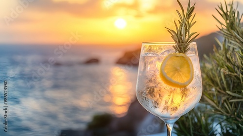 Refreshing Cocktail with Lemon and Rosemary at Sunset.