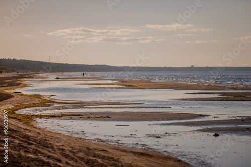 Calm sea waters in Baltic Sea at city Jurmala beach close up of shallow waters