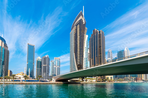 Photography The Mohammad Bin Ahmed Al Mulla mosque alongside modern skyscrapers near the Al Emreef Street bridge seen from the banks of the Dubai Marina, in Dubai, United Arab Emirates