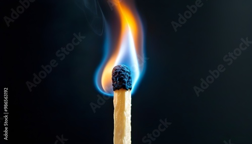 Luminous blue flames dancing on a matchstick against a velvety black backdrop