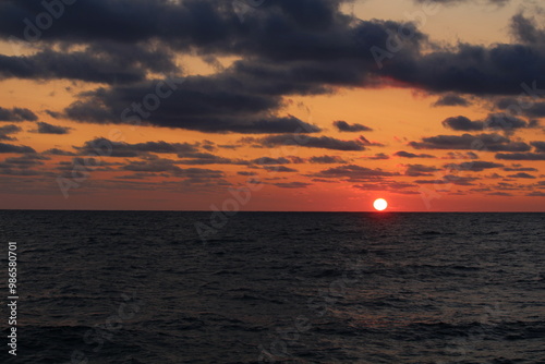 Sunset over the horizon in the North Sea  photo