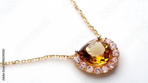 Elegant amber and morganite necklace with a golden amber stone and peachpink morganite in a delicate gold chain photo