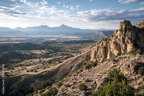 Panoramic View of Majestic Mountain Range with Desert Landscape and Blue Sky