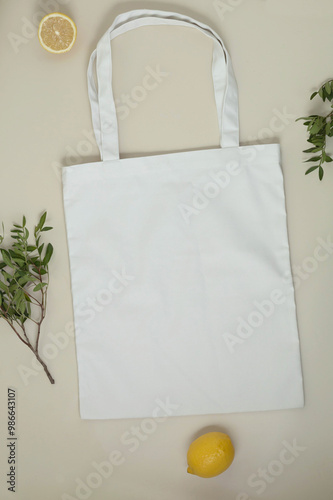 Shopper bag mockup or shopping bag template made of white canvas fabric on beige background