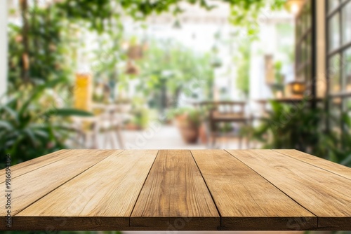 Empty wooden table top with blurred bokeh background of green garden and modern coffee shop interior, high definition wide-angle shot, boho aesthetic for product display.