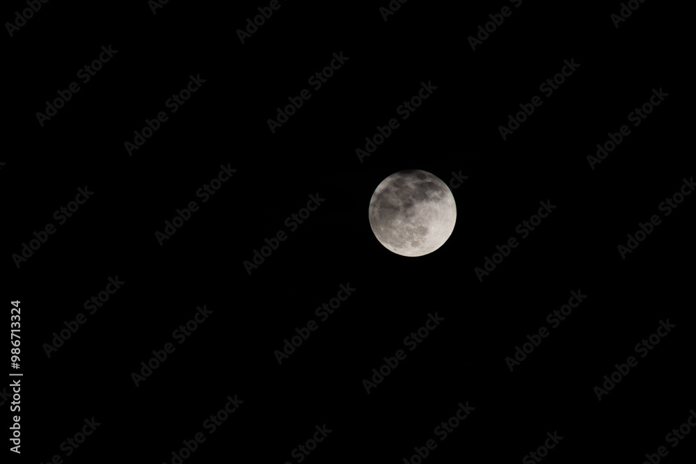 Full moon at night with dark sky background, Black and white. Full moon at night with dark sky background, Black and white.