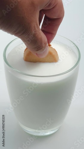 Dipping a cookie in milk, savoring the perfect balance of sweetness and creaminess.