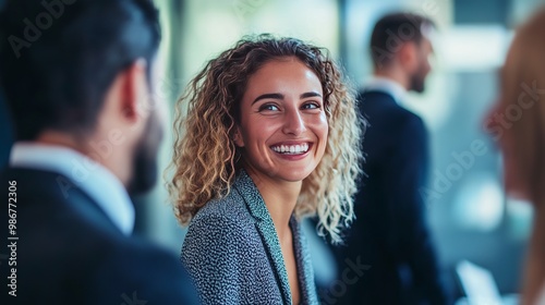 Colleagues conversing among themselves in a conference room during a business meeting. Men and women in the corporate world who are happy working together to achieve their common objectives. 