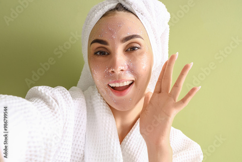 Young woman with facial mas...