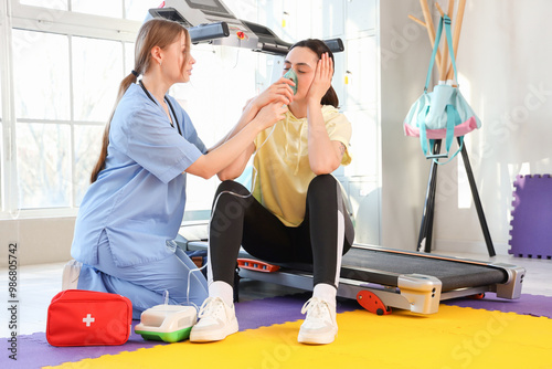 Female doctor with nebulize...