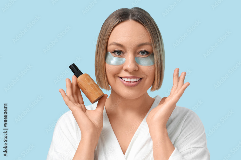 Beautiful mature woman with under-eye patches and bottle of cosmetic product on color background, closeup Beautiful mature woman with under-eye patches and bottle of cosmetic product on color background, closeup