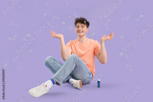 Young man with soap bubbles...