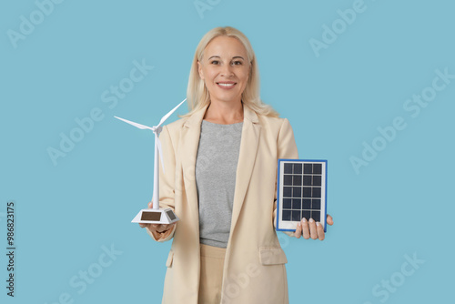 Mature woman with wind turb...