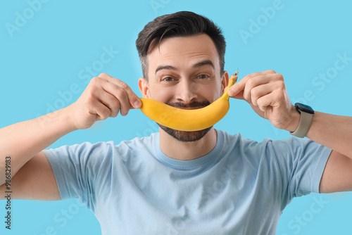 Young man with banana on bl...