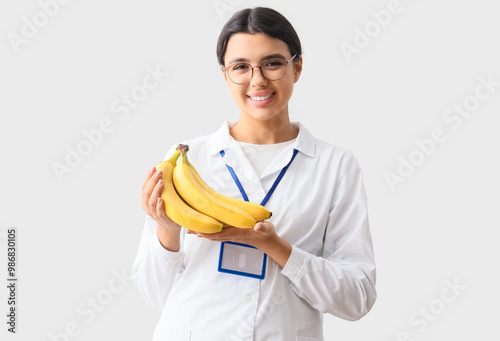 Female doctor with bananas ...