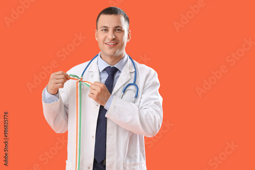Male physician with ribbon ...