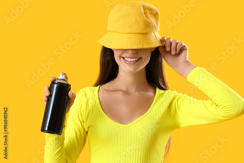 Young girl with spray can o...