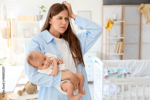 Young mother suffering from...