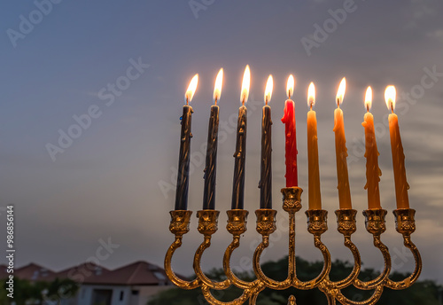 Hebrew Holiday of Light, selective focus on menorah with burning  wax candles...
